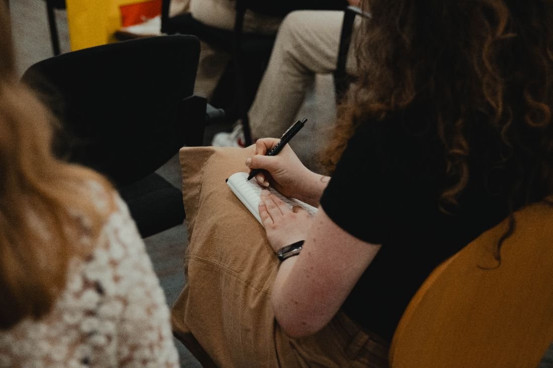 Attendee taking notes